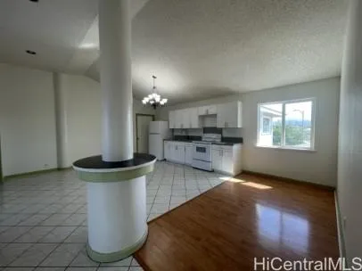 a view of a kitchen with furniture and a window