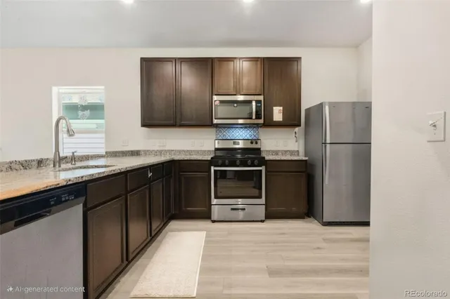 a kitchen with a refrigerator and a sink