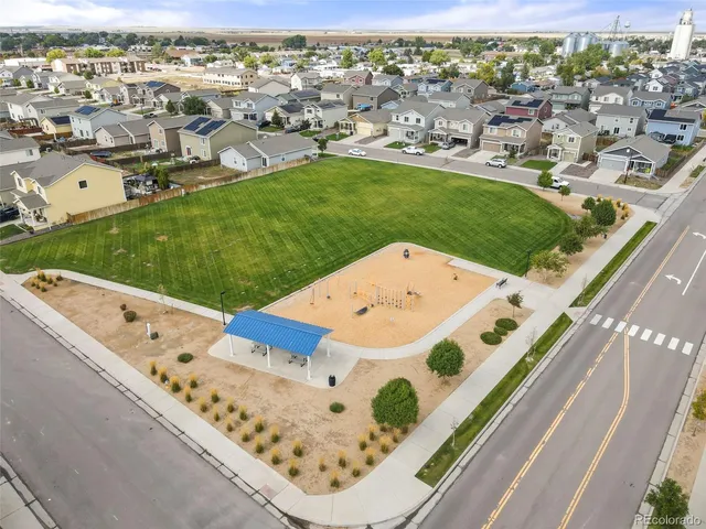 an aerial view of a house with a garden