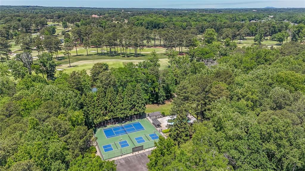 3712 Frederica Road Northwest Berkeley Lake, GA 30096 - Photo 43 of 49 an aerial view of residential house with outdoor space and trees all around