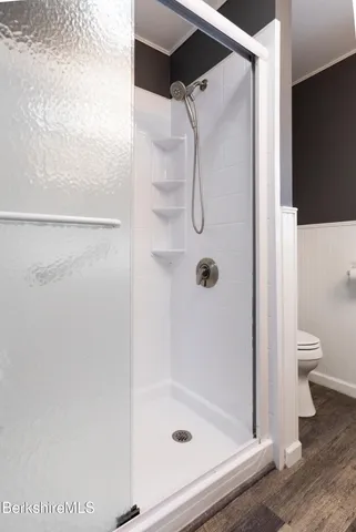 a bathroom with a glass shower door