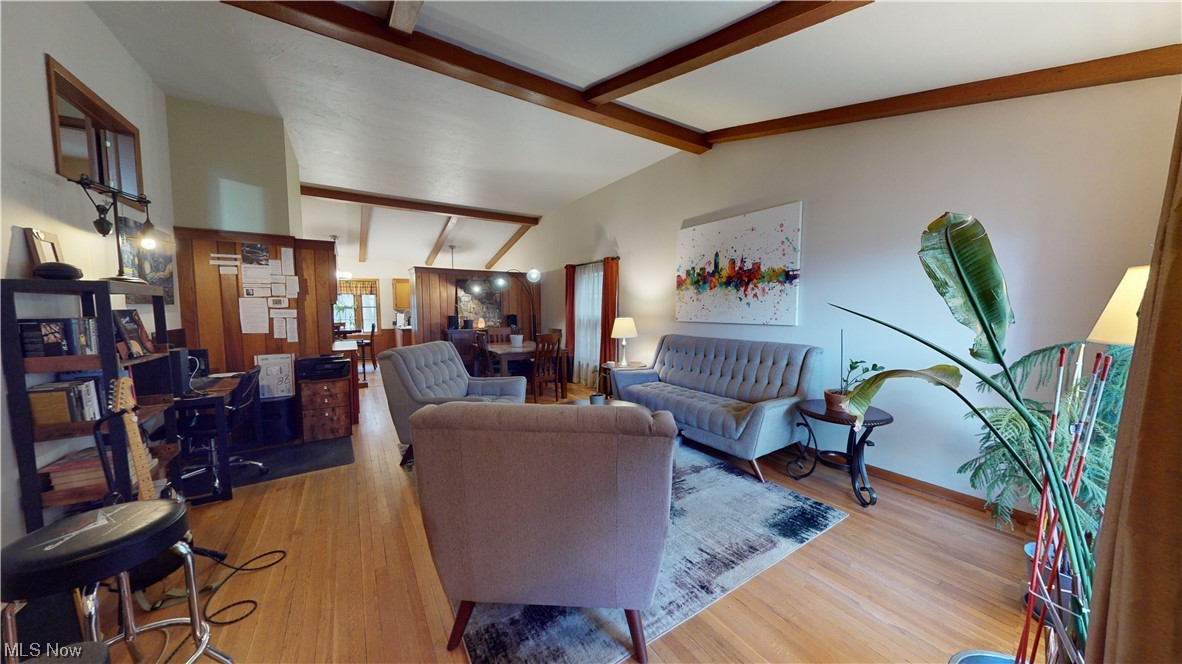 1243 Yellowstone Road Cleveland, OH 44121 - Photo 2 of 28 Living room with lofted ceiling with beams and light hardwood / wood-style floors