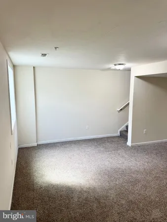 a picture of a bench in front of a window