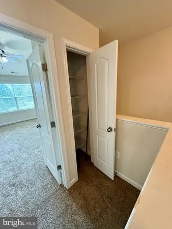 an entryway door with a hallway in the back