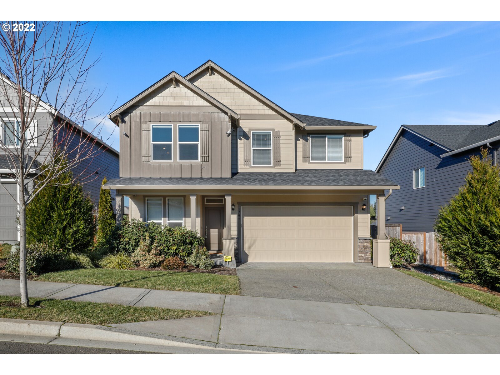 1704 Northeast 172nd Street Ridgefield, WA 98642 - Photo 1 of 31 a front view of a house with garden
