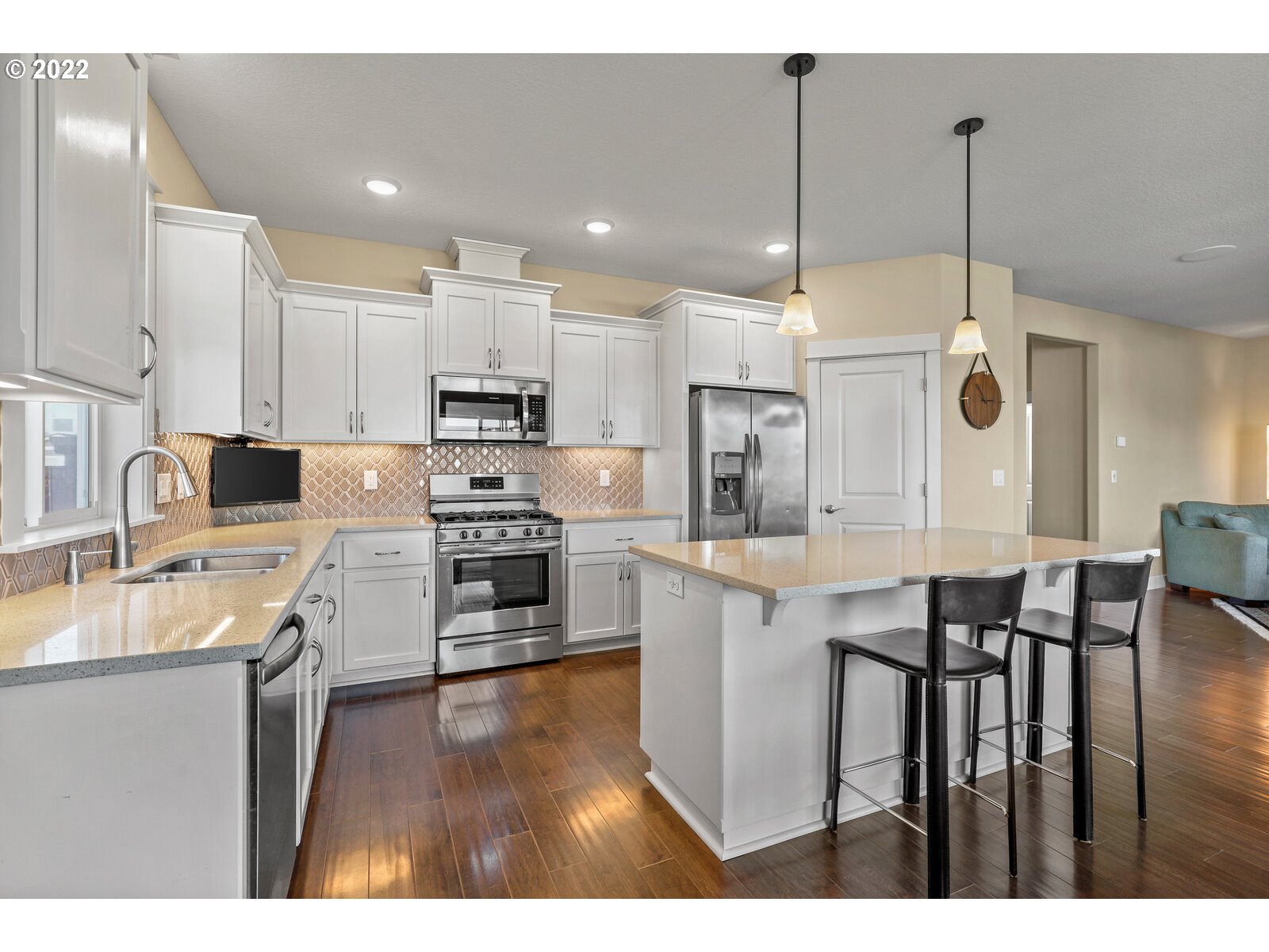 1704 Northeast 172nd Street Ridgefield, WA 98642 - Photo 11 of 31 a kitchen with stainless steel appliances granite countertop a sink refrigerator and cabinets