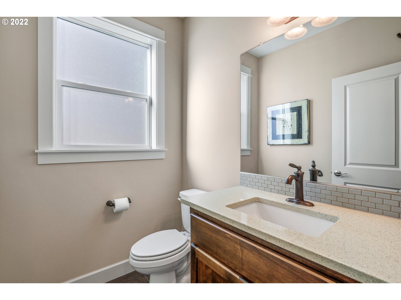 1704 Northeast 172nd Street Ridgefield, WA 98642 - Photo 15 of 31 a bathroom with a sink toilet and mirror