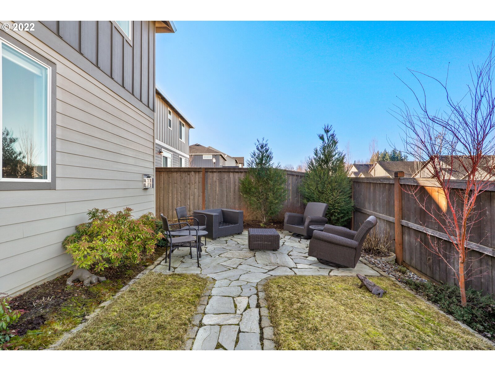 1704 Northeast 172nd Street Ridgefield, WA 98642 - Photo 30 of 31 a view of backyard with seating space and wooden fence