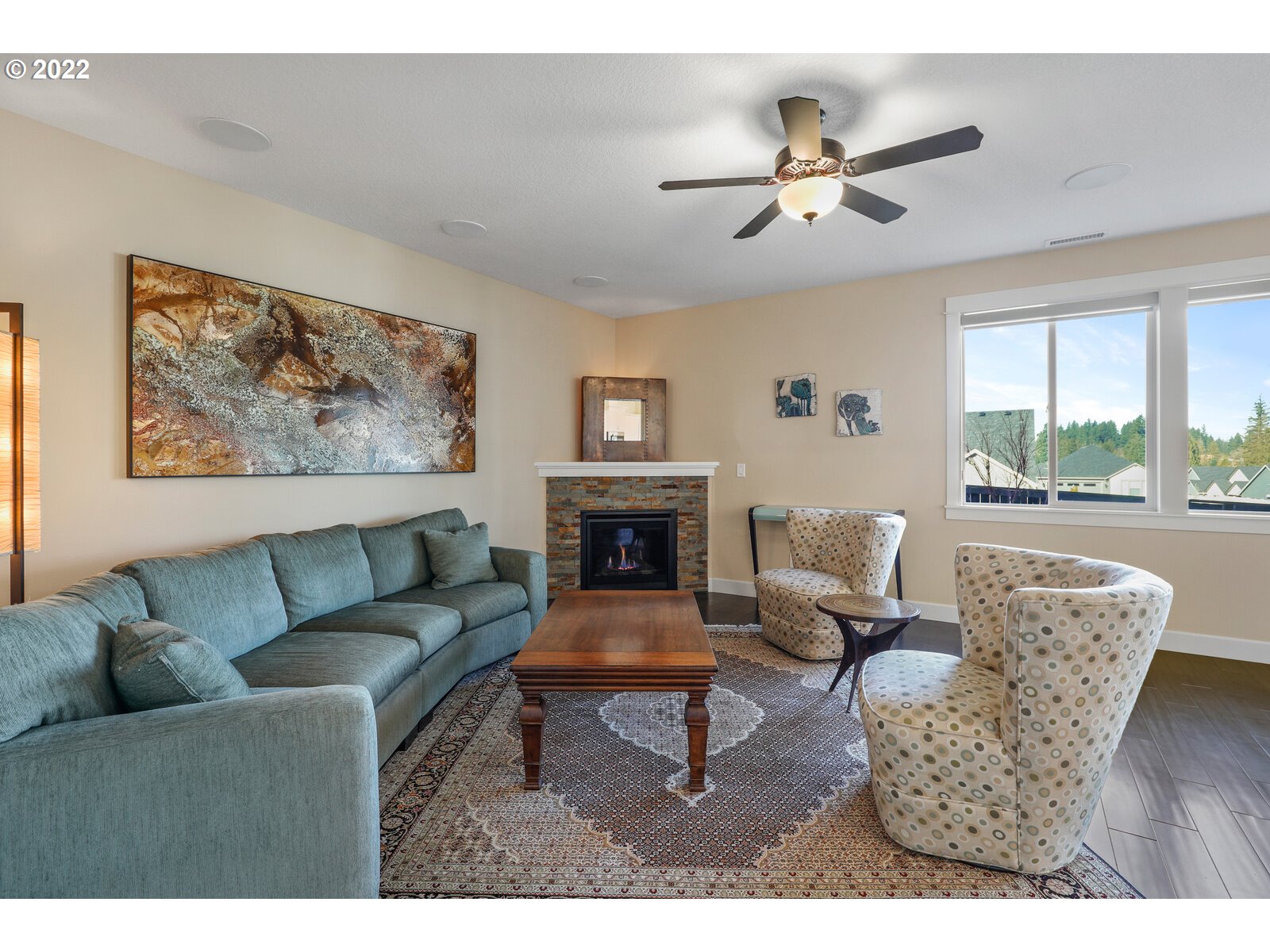 1704 Northeast 172nd Street Ridgefield, WA 98642 - Photo 6 of 31 a living room with furniture a fireplace and windows