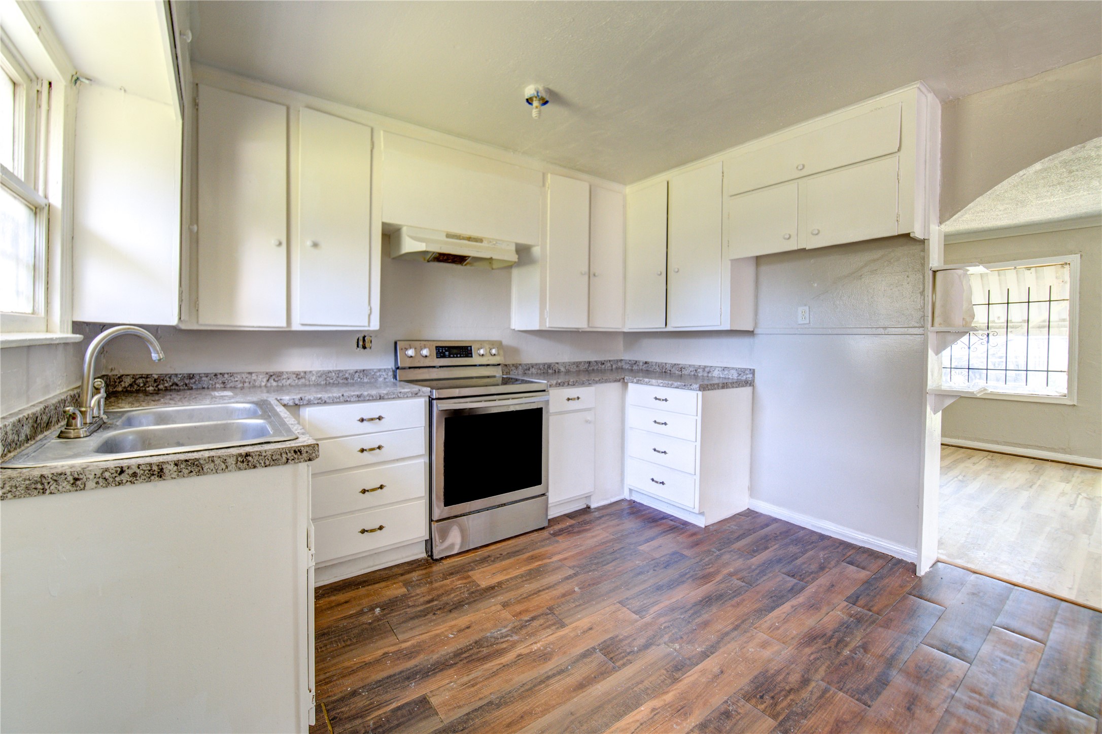 3431 Sayers Street Houston, TX 77026 - Photo 16 of 44 a kitchen with a stove top oven sink and cabinets