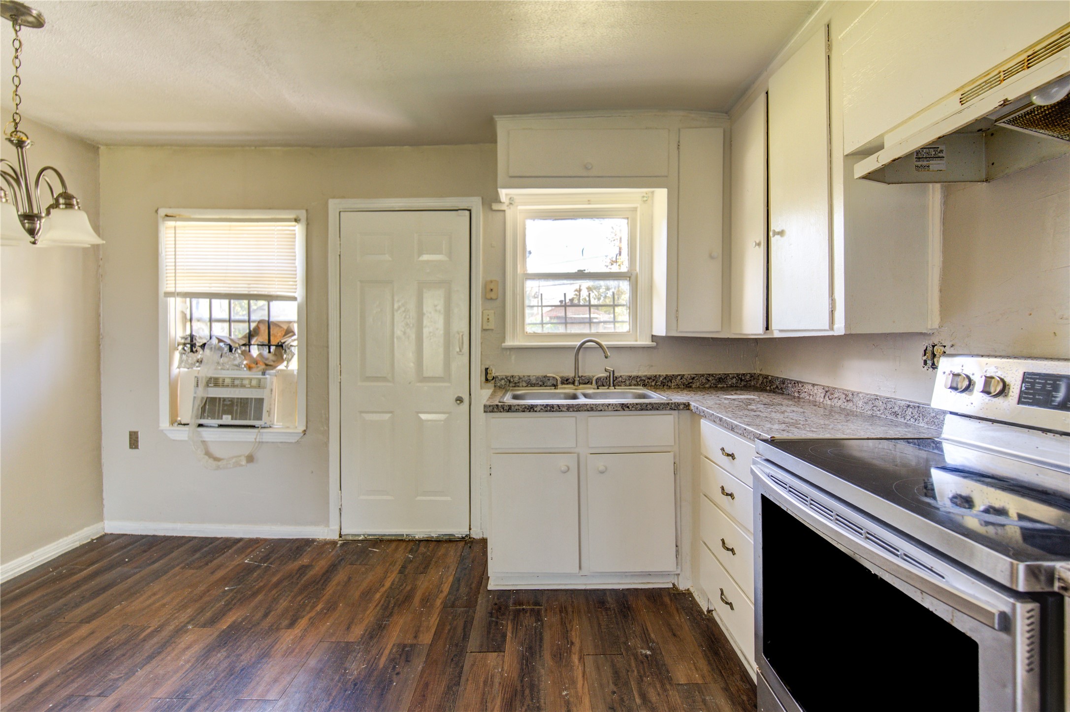 3431 Sayers Street Houston, TX 77026 - Photo 17 of 44 a kitchen with wooden floors and appliances