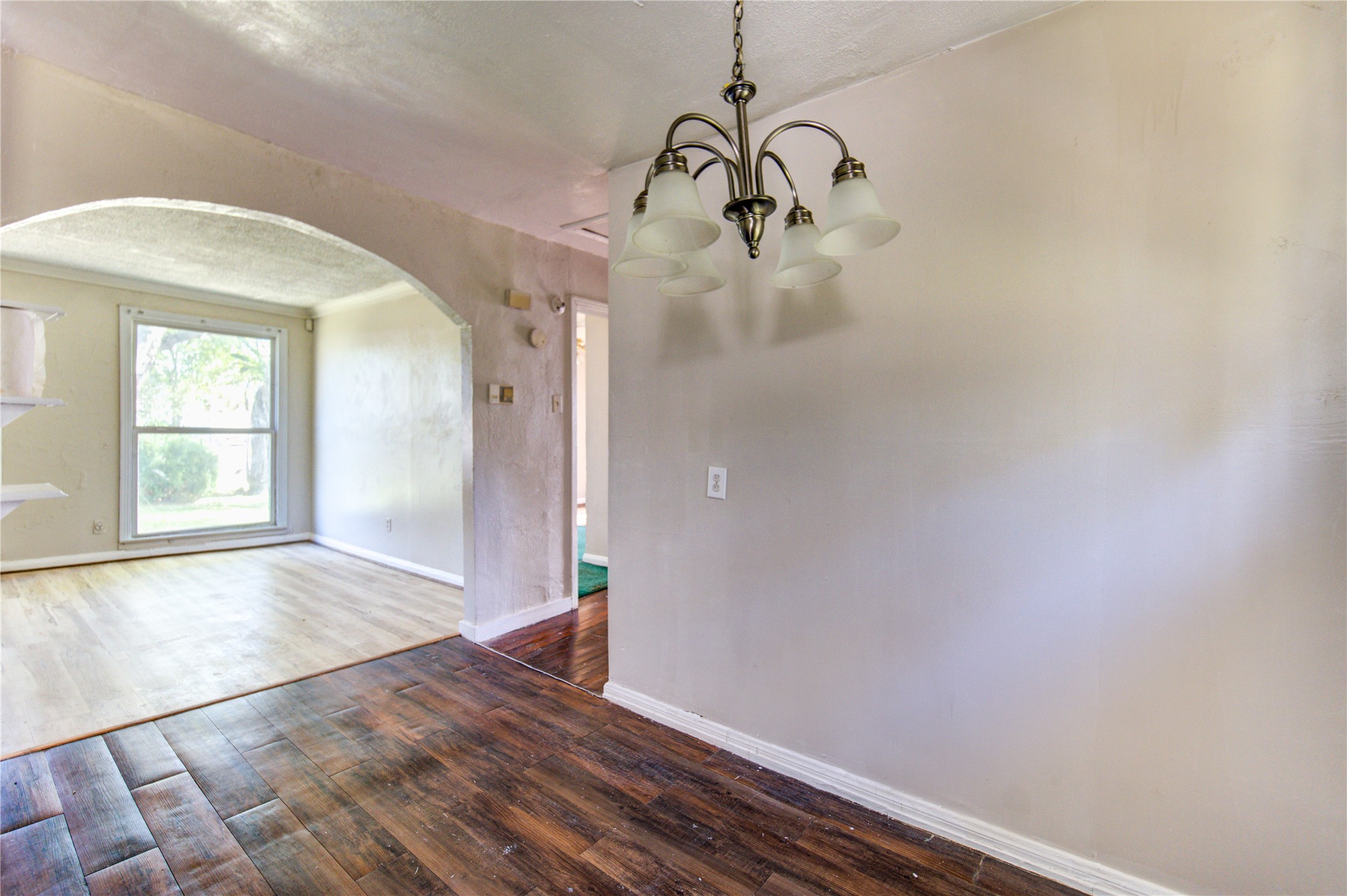 3431 Sayers Street Houston, TX 77026 - Photo 18 of 44 a view of empty room with wooden floor and fan