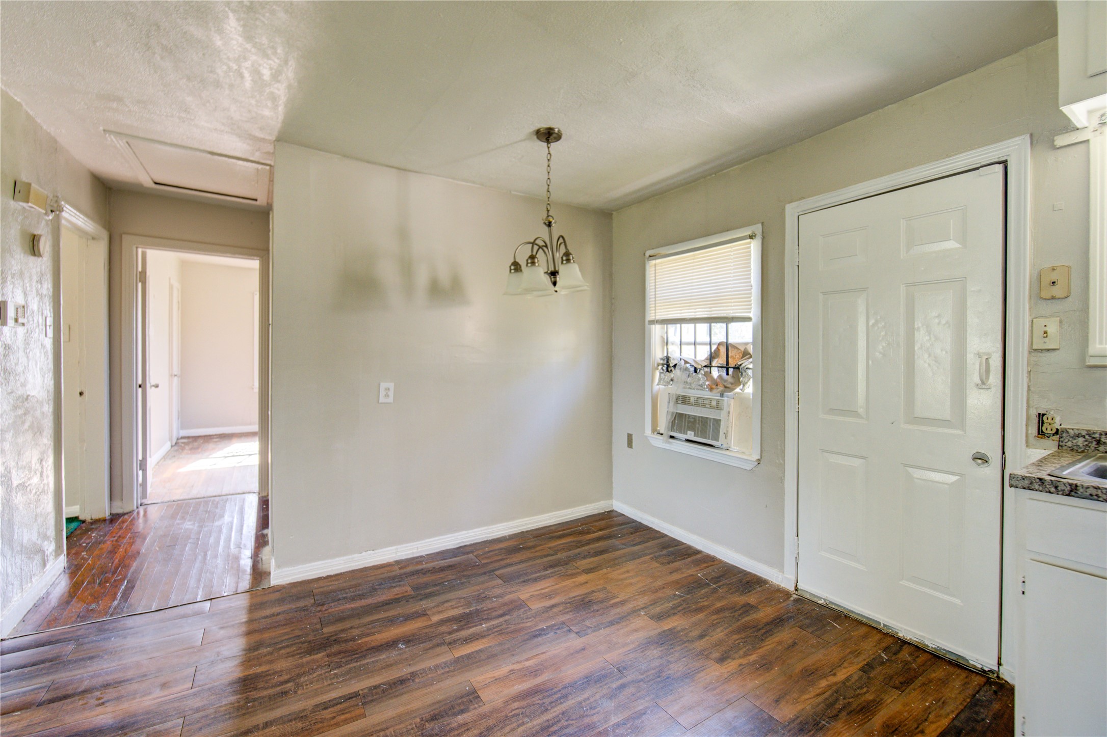 3431 Sayers Street Houston, TX 77026 - Photo 20 of 44 a view of a bathroom with a shower and a window