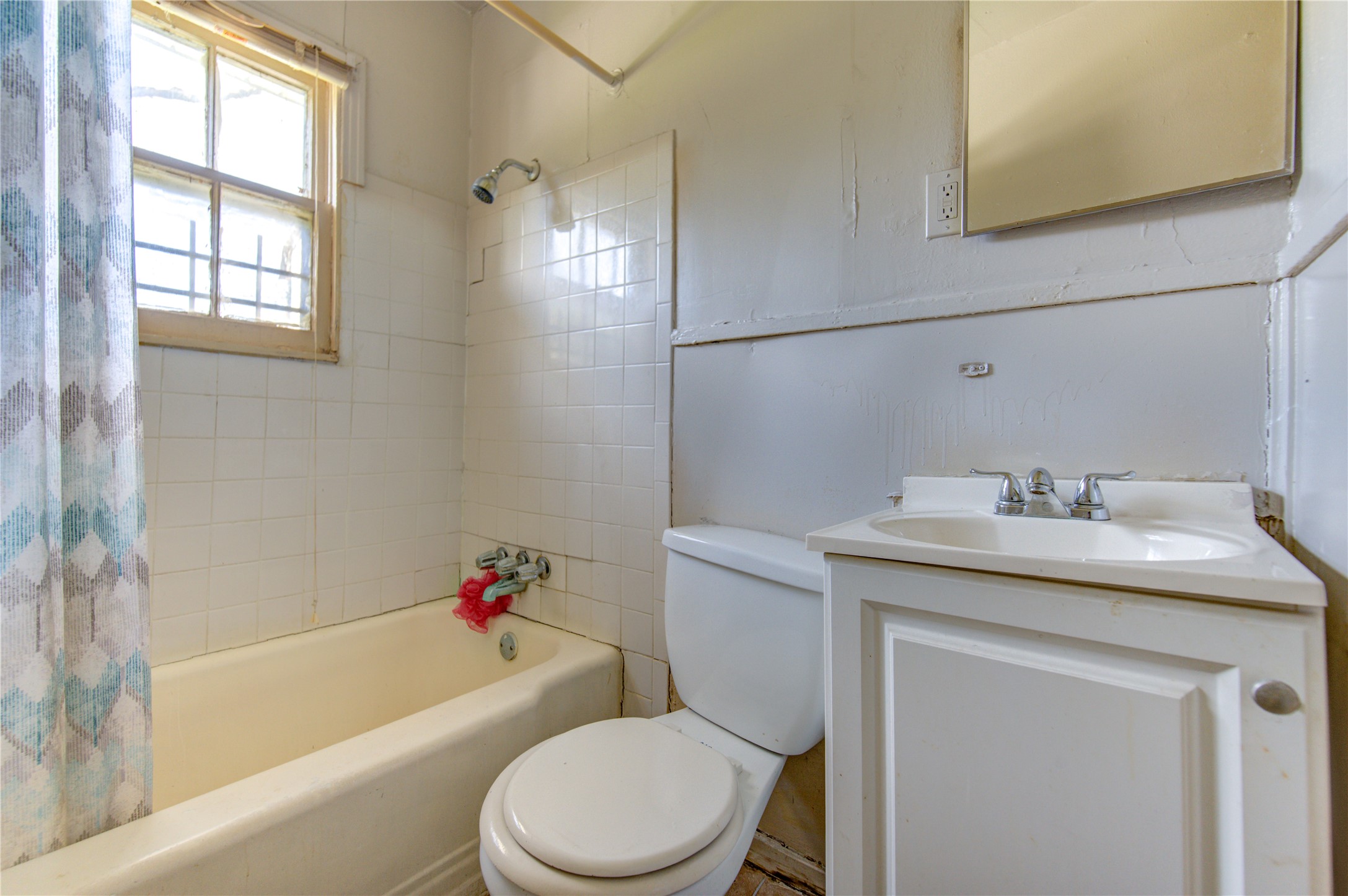 3431 Sayers Street Houston, TX 77026 - Photo 31 of 44 a bathroom with a granite countertop toilet sink and mirror