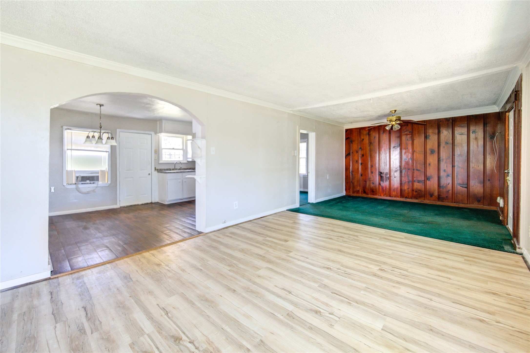 3431 Sayers Street Houston, TX 77026 - Photo 9 of 44 an empty room with wooden floor and windows