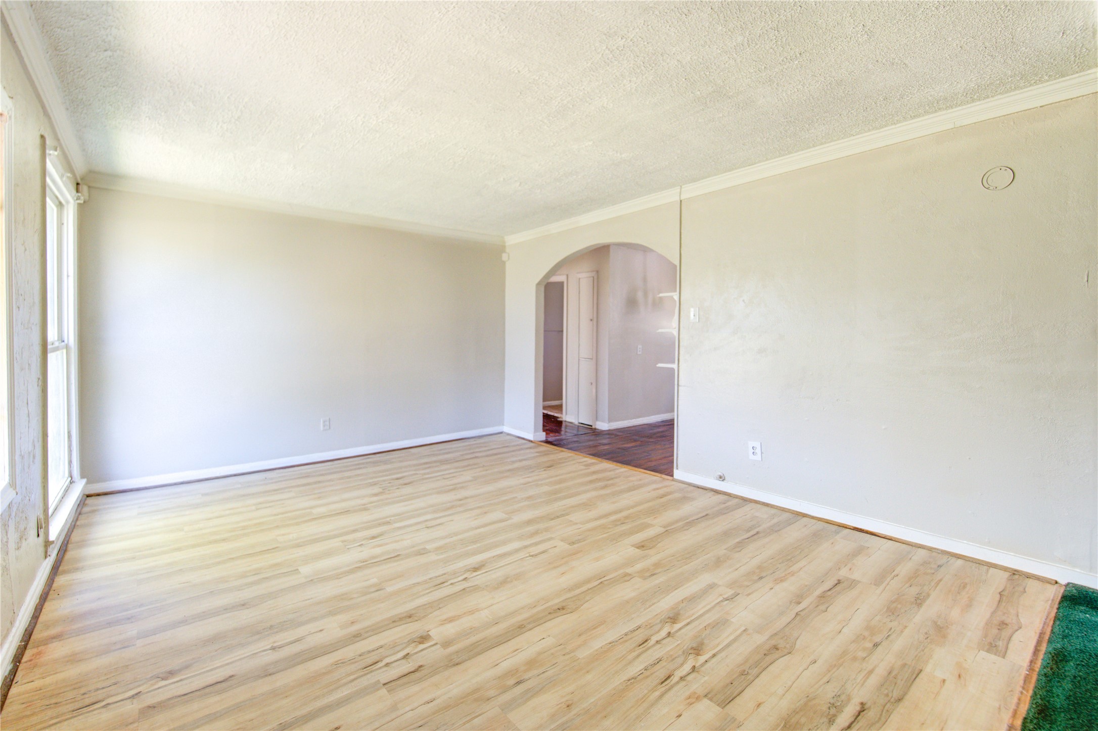 3431 Sayers Street Houston, TX 77026 - Photo 10 of 44 a view of empty room with wooden floor