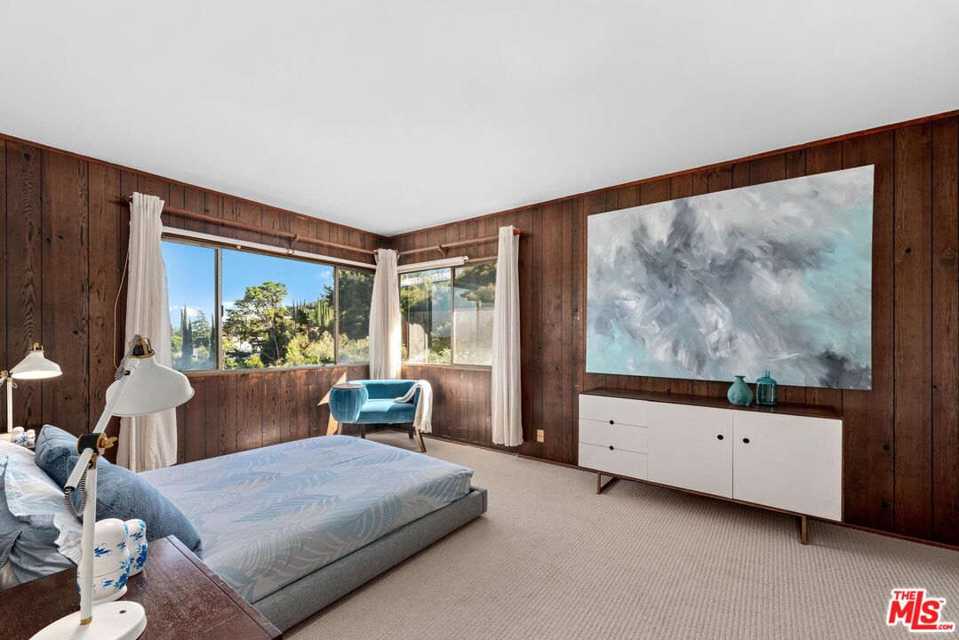 8636 Edwin Drive Los Angeles, CA 90046 - Photo 16 of 25 a living room with furniture and a flat screen tv
