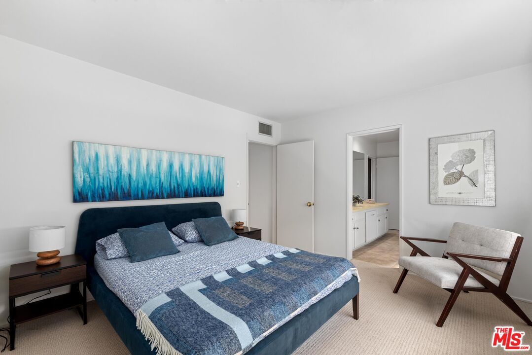 8636 Edwin Drive Los Angeles, CA 90046 - Photo 18 of 25 a bedroom with a bed and a couch