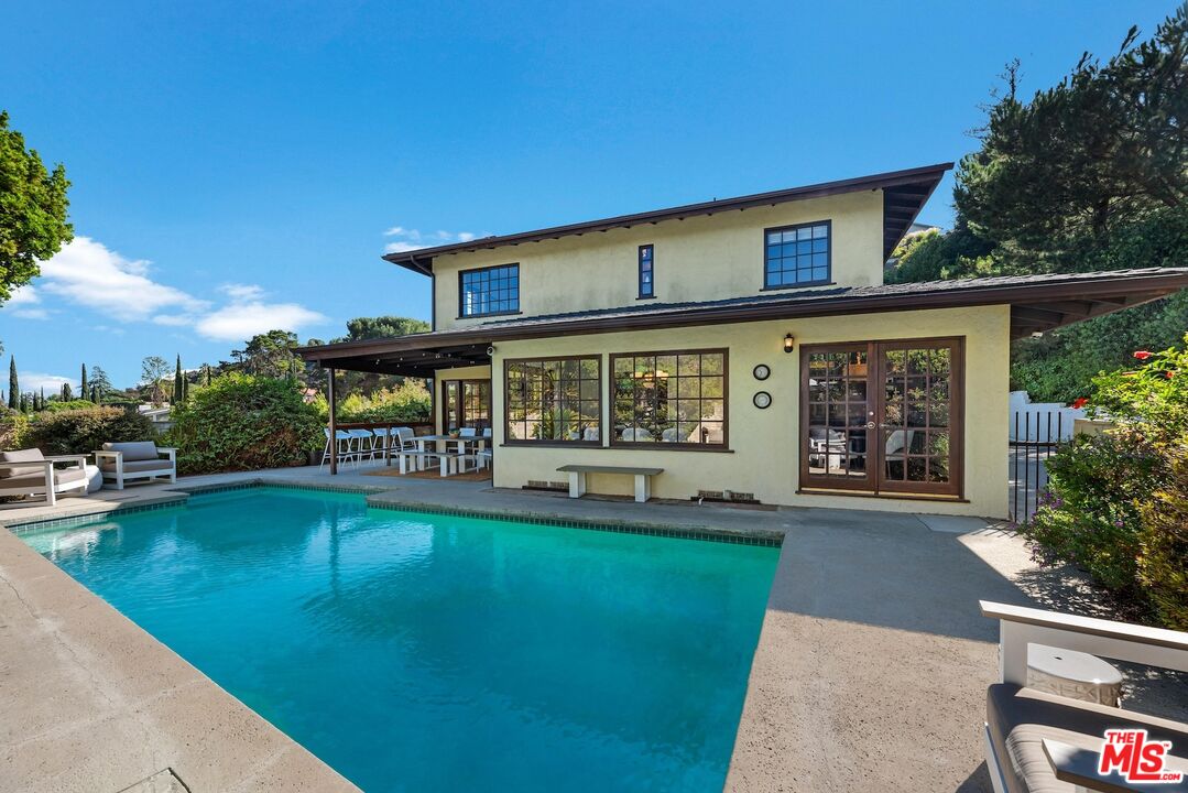 8636 Edwin Drive Los Angeles, CA 90046 - Photo 20 of 25 swimming pool view with a seating space and garden view