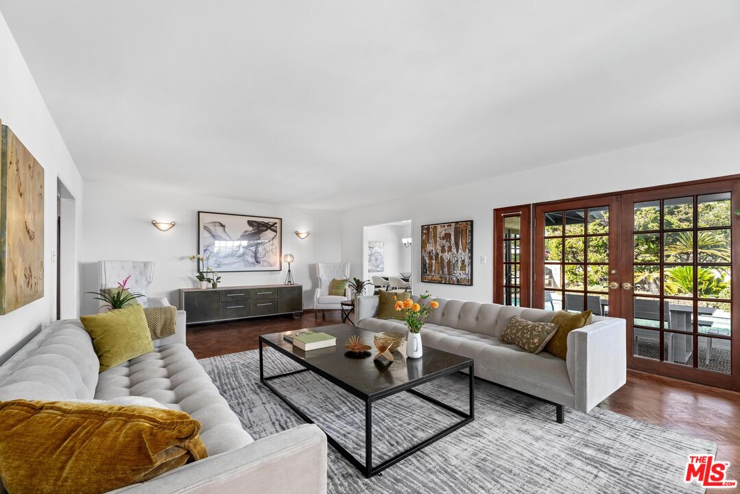 8636 Edwin Drive Los Angeles, CA 90046 - Photo 4 of 25 a living room with furniture and a large window