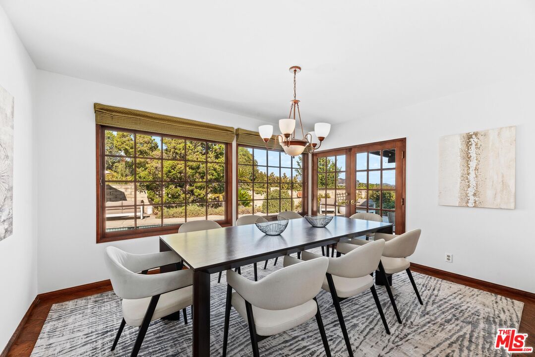 8636 Edwin Drive Los Angeles, CA 90046 - Photo 8 of 25 a view of a dining room with furniture window and wooden floor