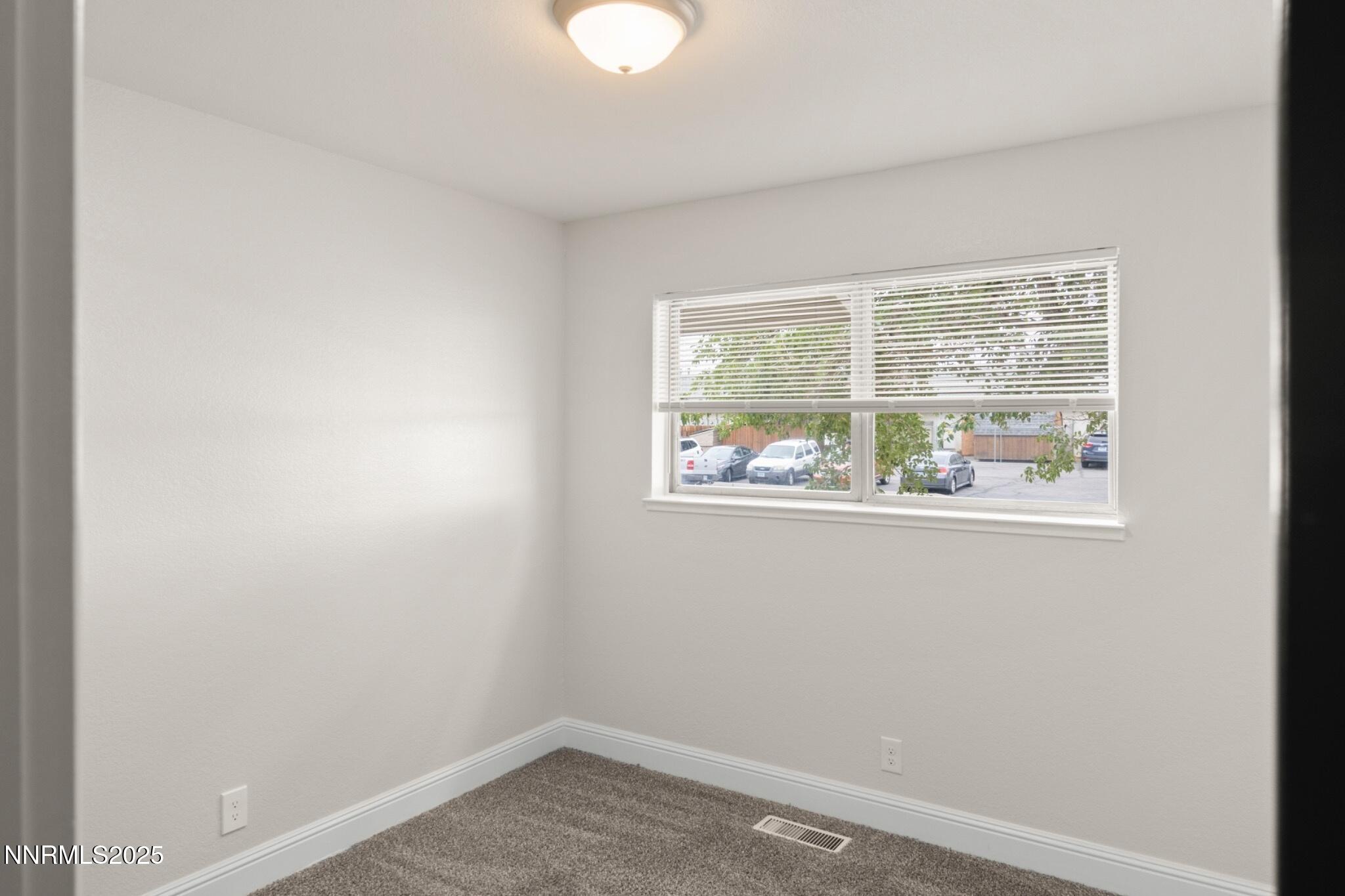 859 B Street Fernley, NV 89408 - Photo 16 of 32 an empty room with a window