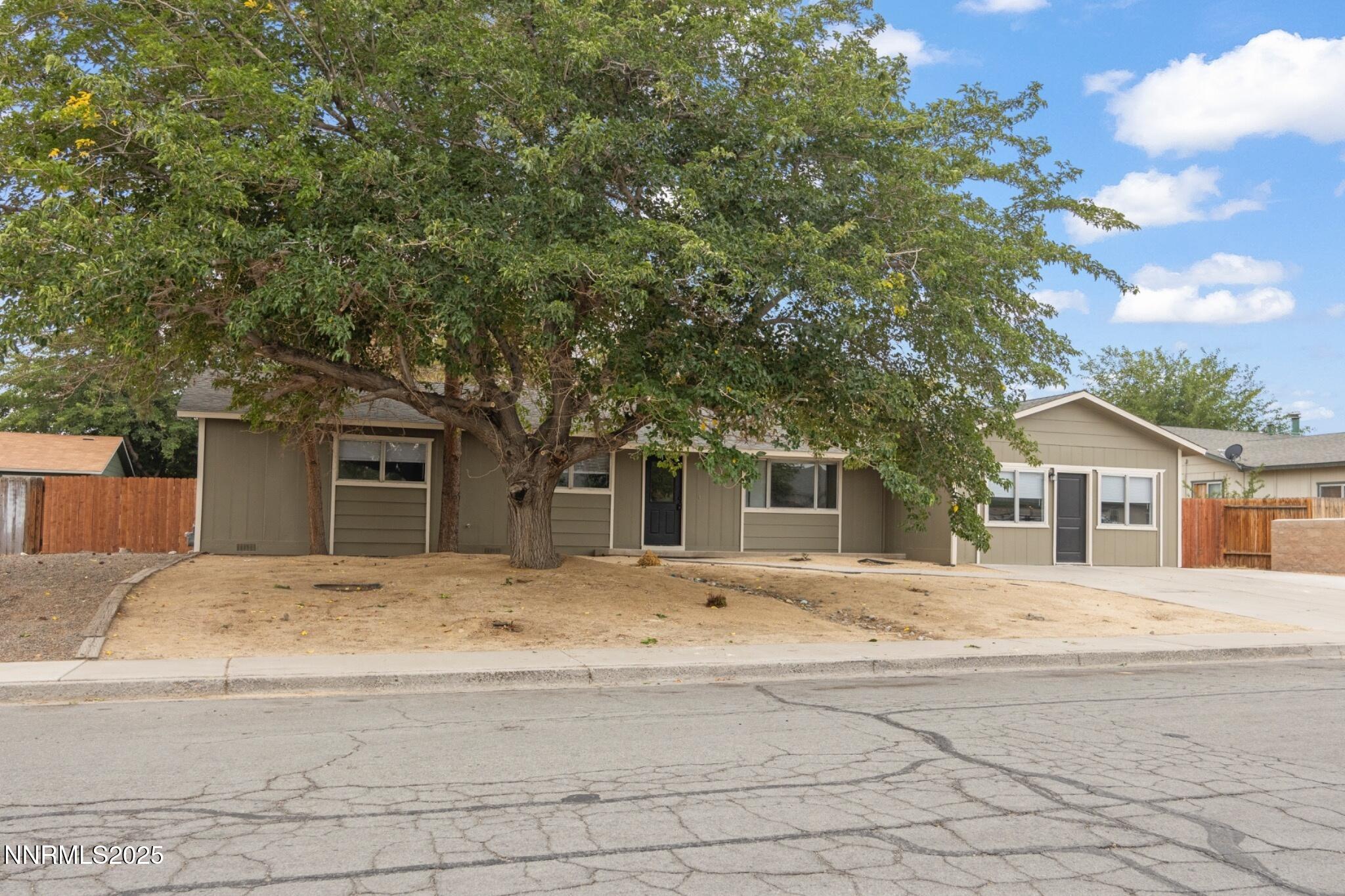 859 B Street Fernley, NV 89408 - Photo 2 of 32 a house with trees in the background