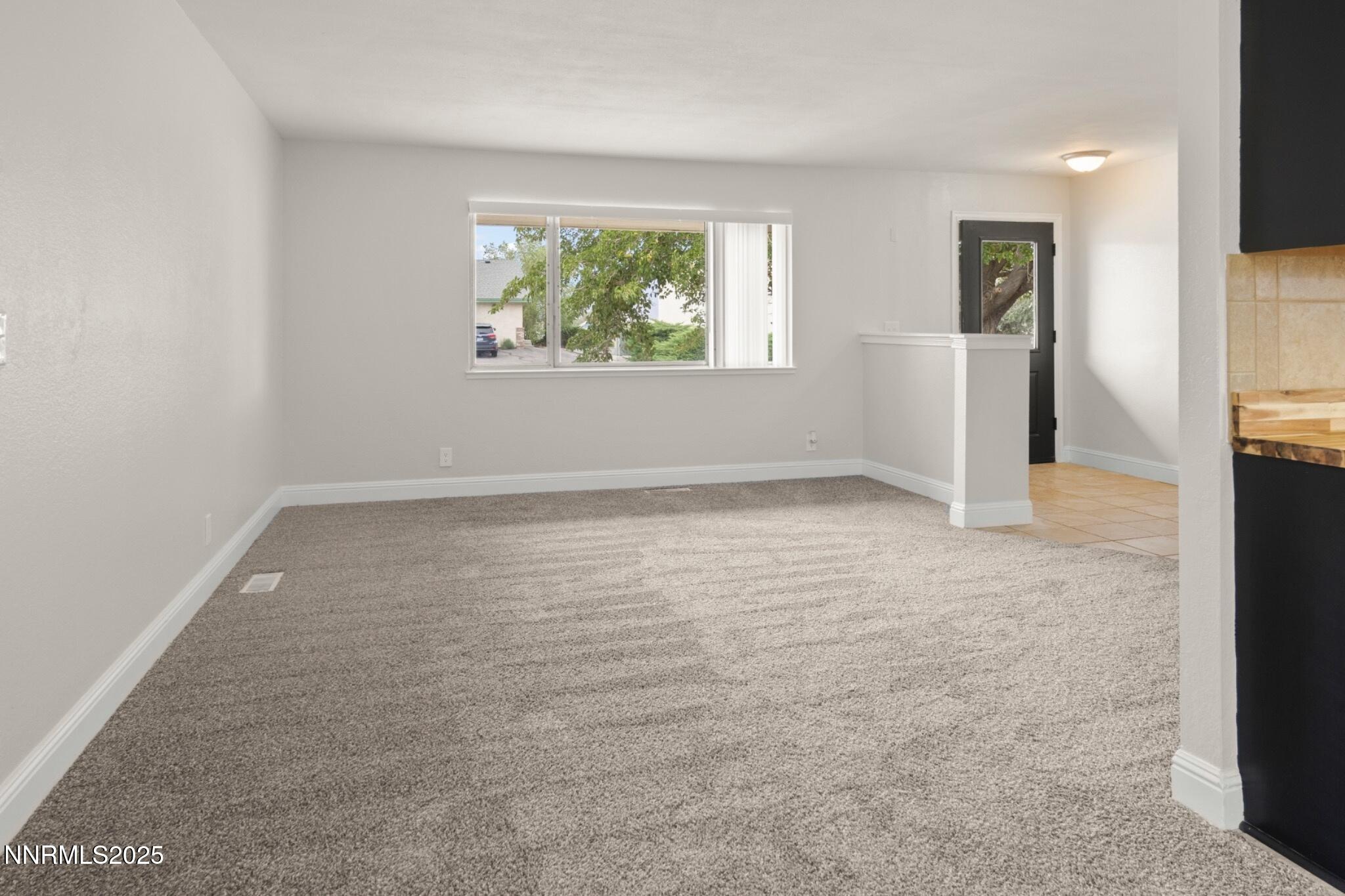 859 B Street Fernley, NV 89408 - Photo 8 of 32 an empty room with windows