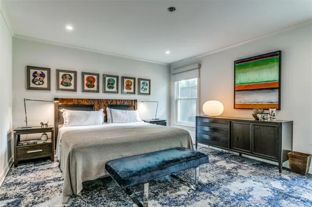 a bedroom with a bed and a television