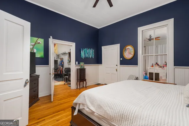 a bedroom with a bed and cabinets