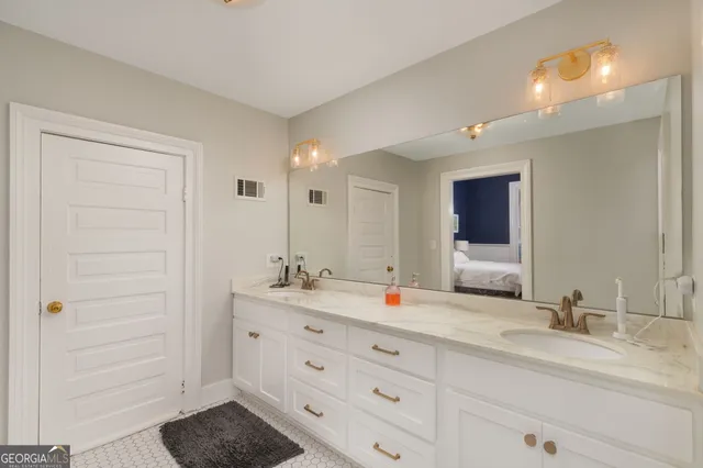 a bathroom with a sink and a mirror