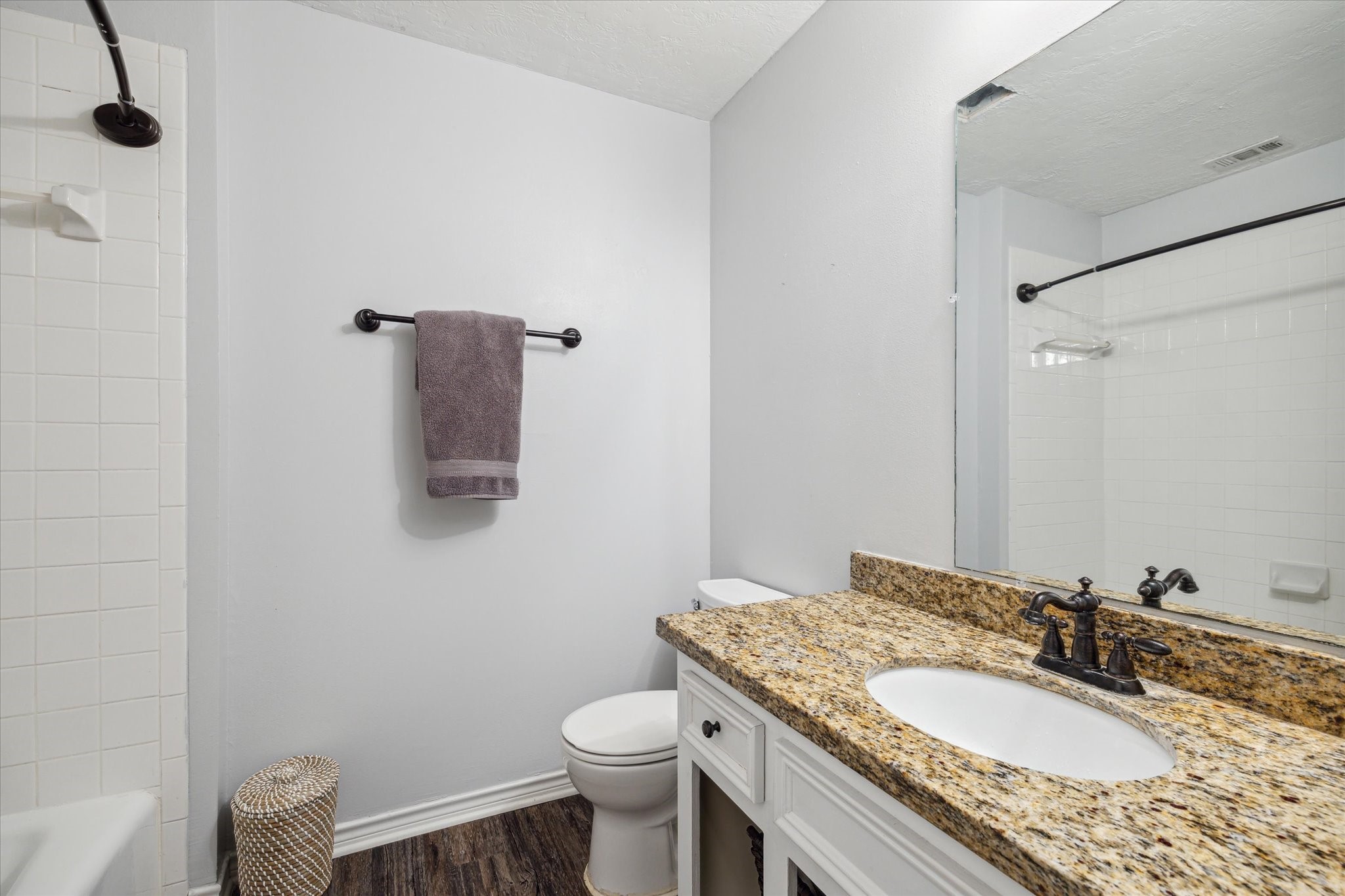 2420 Canter Lane Conroe, TX 77384 - Photo 13 of 24 a bathroom with a granite countertop sink toilet and mirror