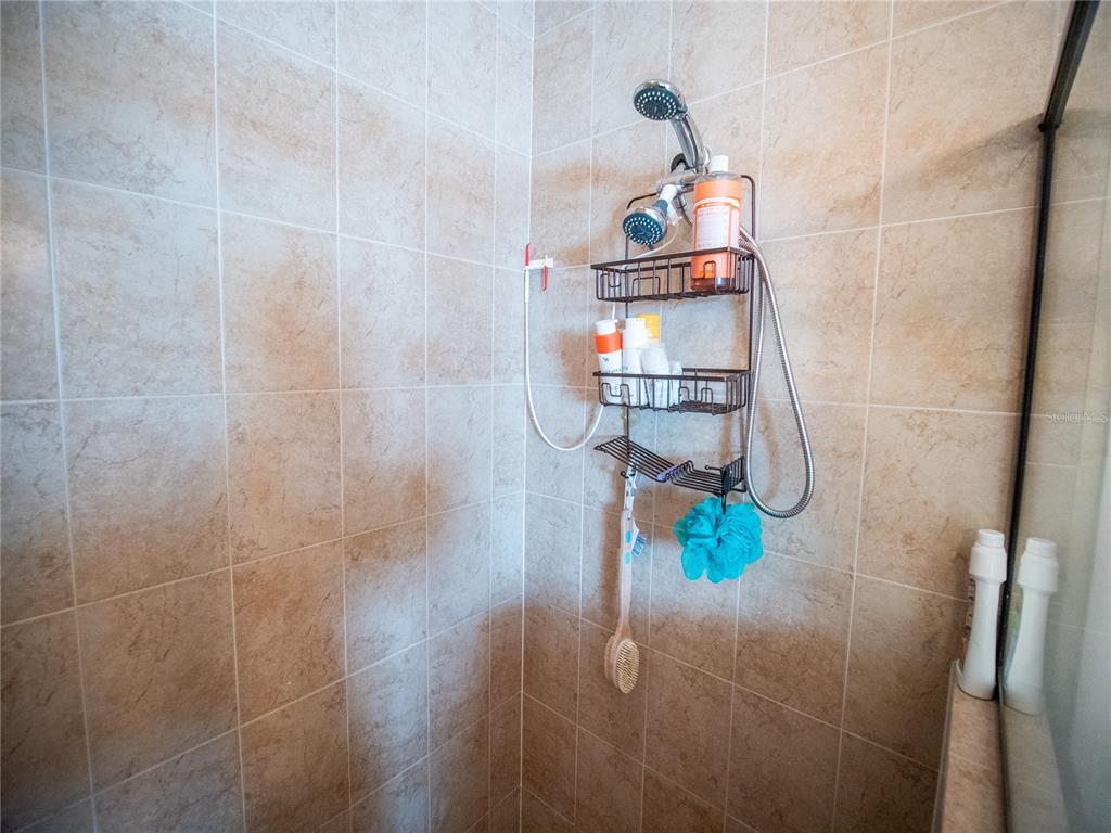 6841 Helmsley Circle Windermere, FL 34786 - Photo 19 of 36 a bathroom with a shower
