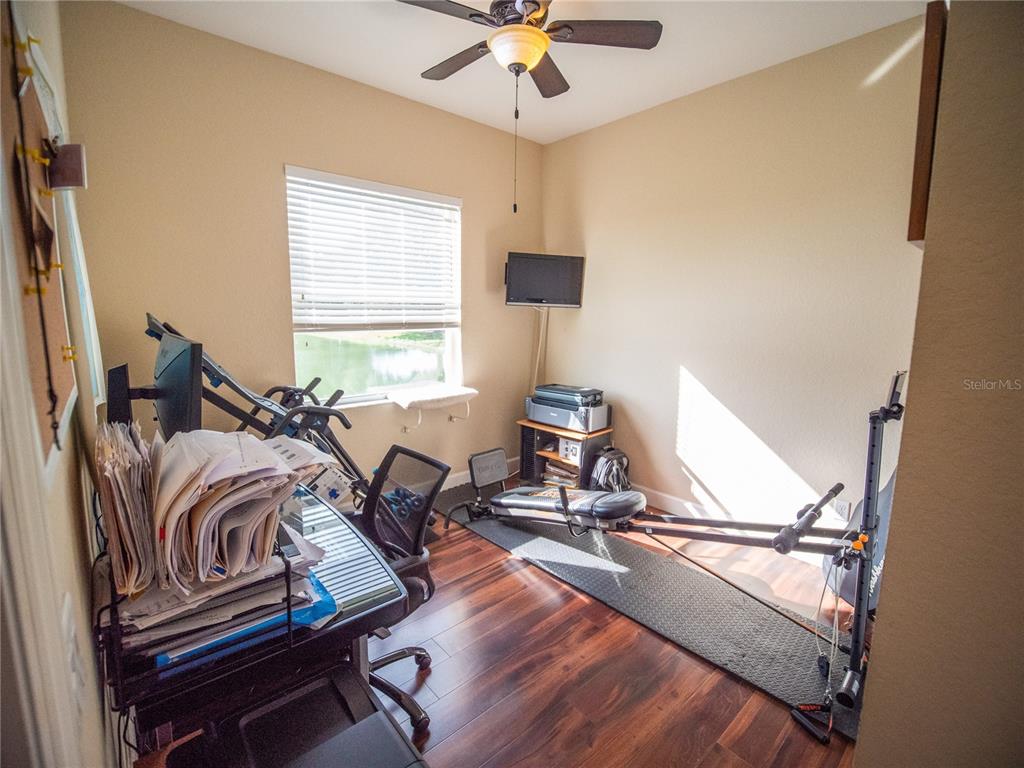 6841 Helmsley Circle Windermere, FL 34786 - Photo 21 of 36 a view of a workspace with furniture and a window