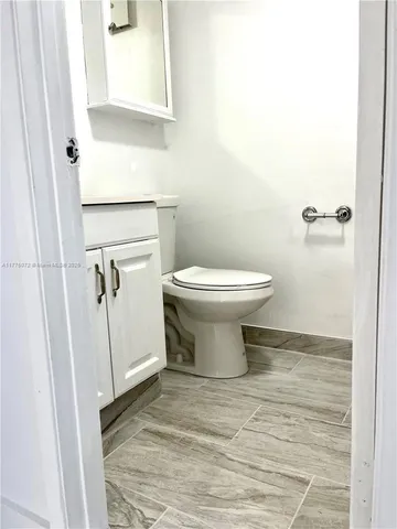 a bathroom with a toilet and a sink
