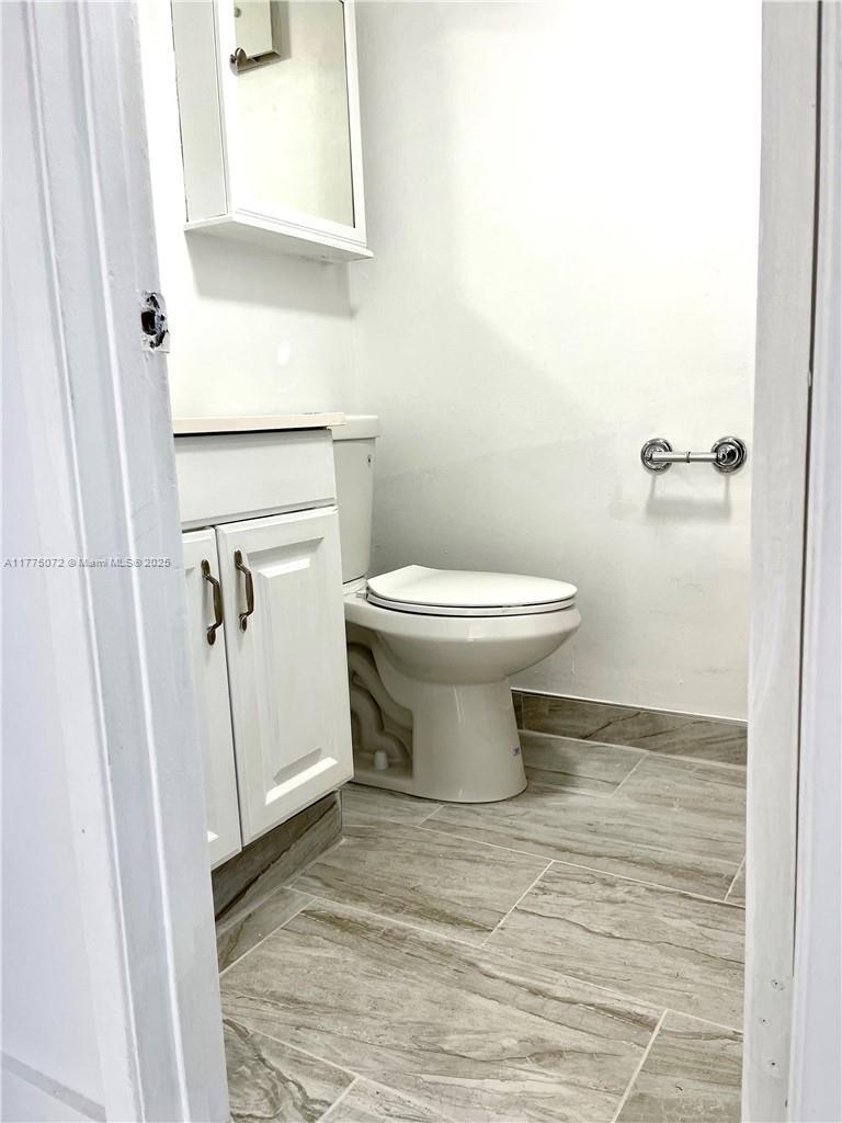 3266 Northwest 104th Avenue, Unit 3266 Coral Springs, FL 33065 - Photo 12 of 15 a bathroom with a toilet and a sink