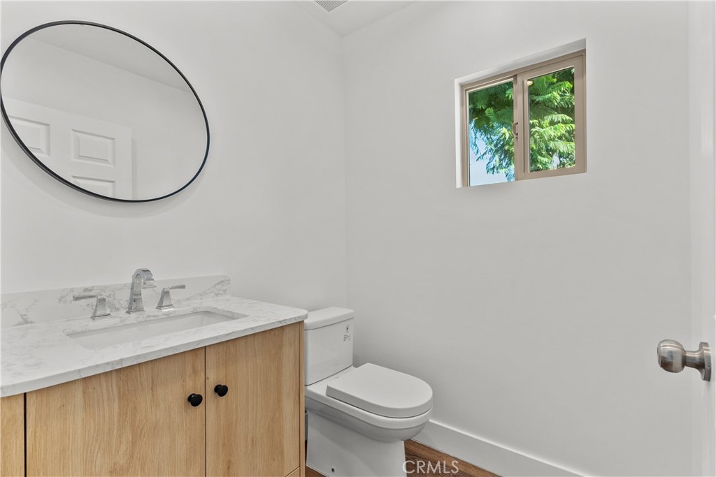 7419 Gloria Avenue Van Nuys, CA 91406 - Photo 17 of 51 a bathroom with a sink and a mirror