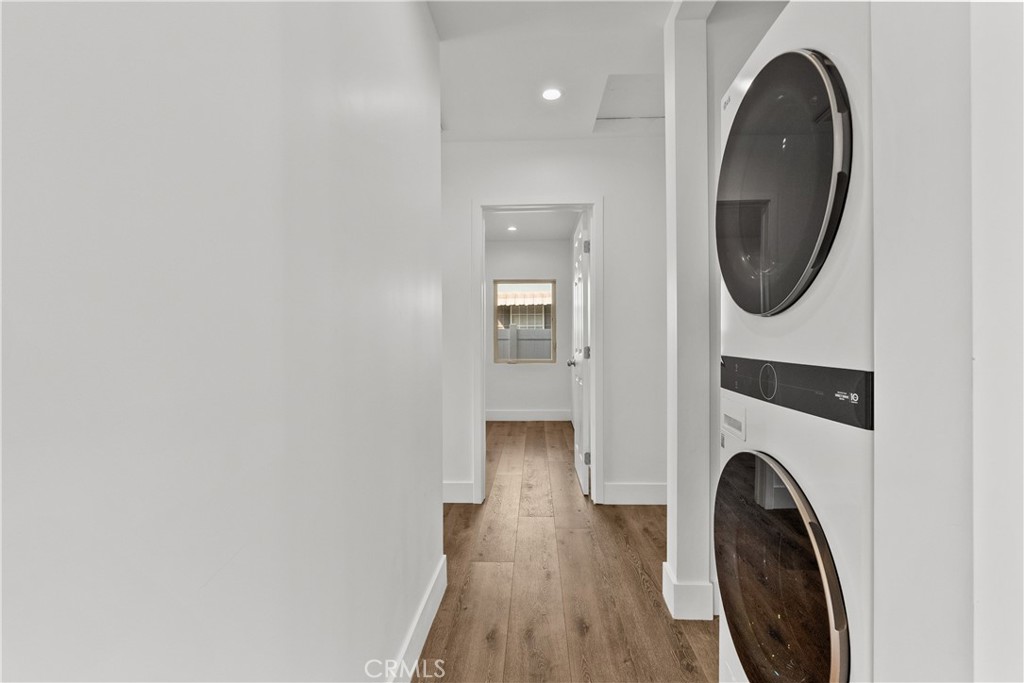 7419 Gloria Avenue Van Nuys, CA 91406 - Photo 19 of 51 a view of a hallway with washer and dryer