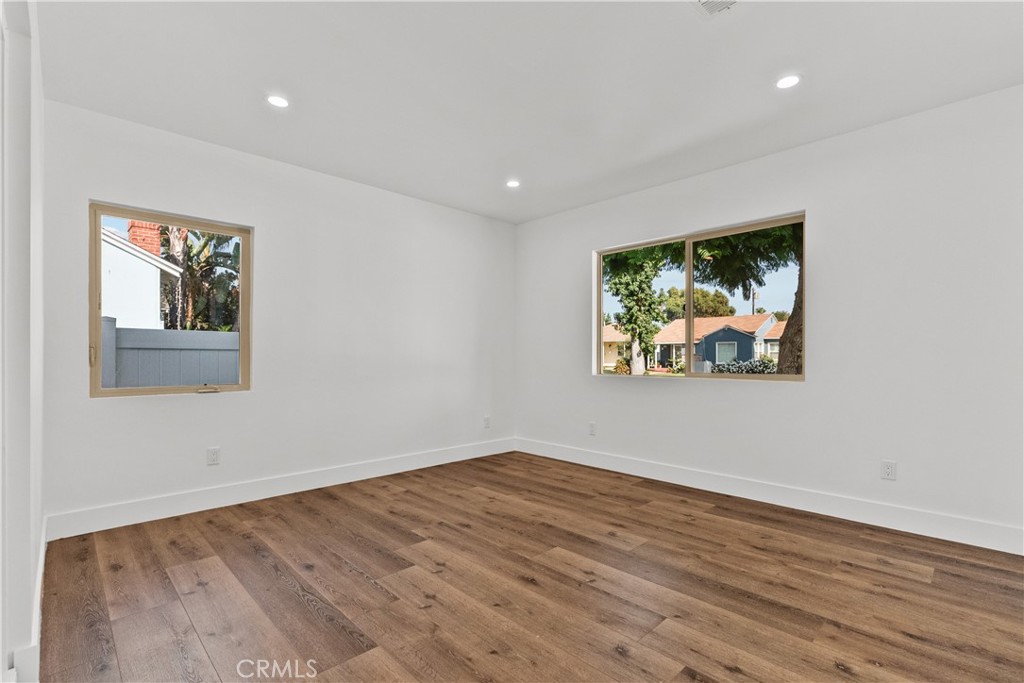 7419 Gloria Avenue Van Nuys, CA 91406 - Photo 20 of 51 a view of a room with wooden floor and window