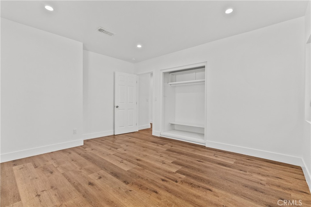 7419 Gloria Avenue Van Nuys, CA 91406 - Photo 21 of 51 a view of empty room with wooden floor