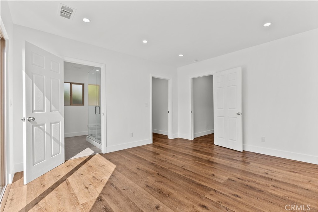 7419 Gloria Avenue Van Nuys, CA 91406 - Photo 25 of 51 a view of a big room with wooden floor and windows
