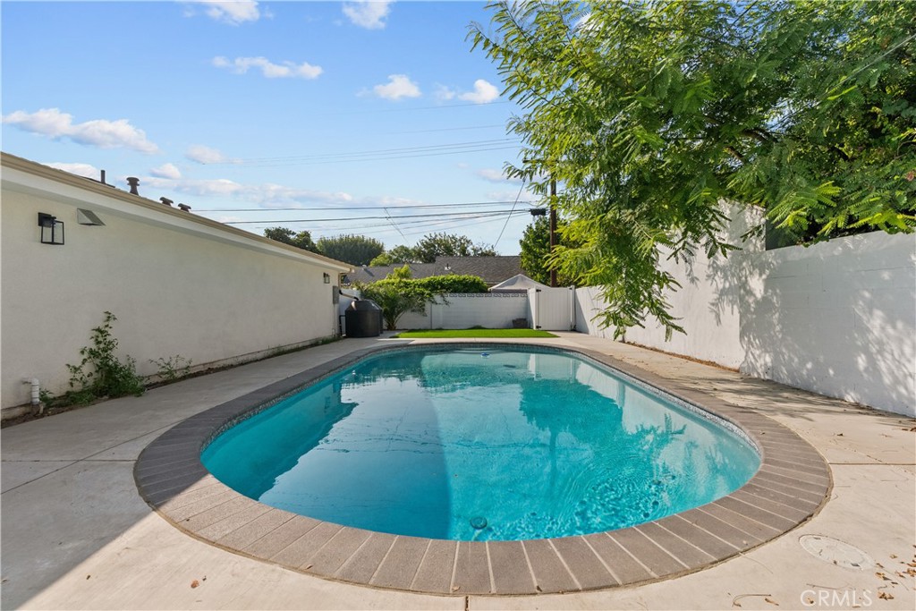7419 Gloria Avenue Van Nuys, CA 91406 - Photo 30 of 51 a view of a swimming pool with a yard