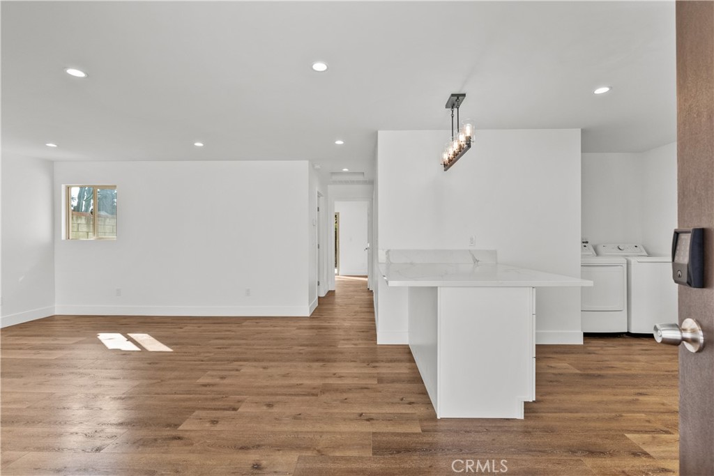 7419 Gloria Avenue Van Nuys, CA 91406 - Photo 32 of 51 a view of kitchen with furniture and wooden floor