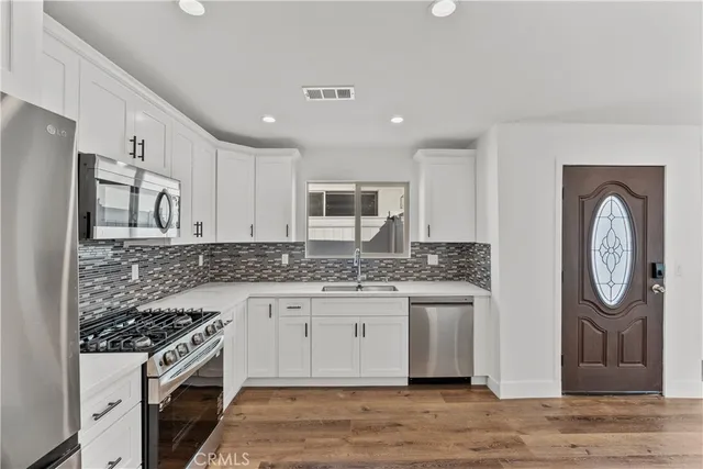 a view of a livingroom with wooden floor