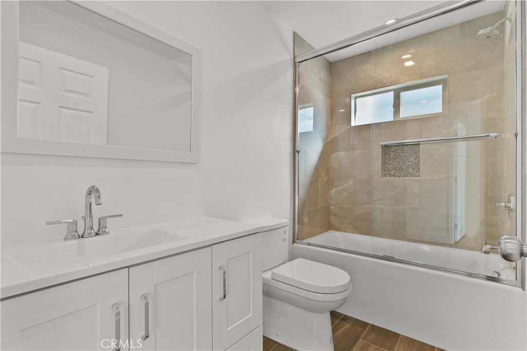 7419 Gloria Avenue Van Nuys, CA 91406 - Photo 44 of 51 a bathroom with a sink a toilet and shower