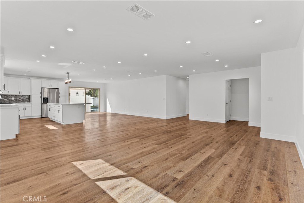 7419 Gloria Avenue Van Nuys, CA 91406 - Photo 7 of 51 a view of empty room with wooden floor