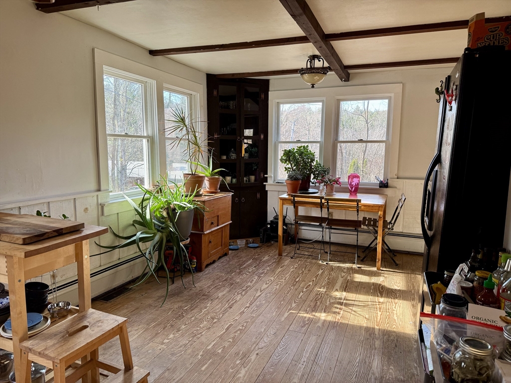 8 Ring Road Worthington, MA 01098 - Photo 5 of 14 a living room filled with furniture and a window