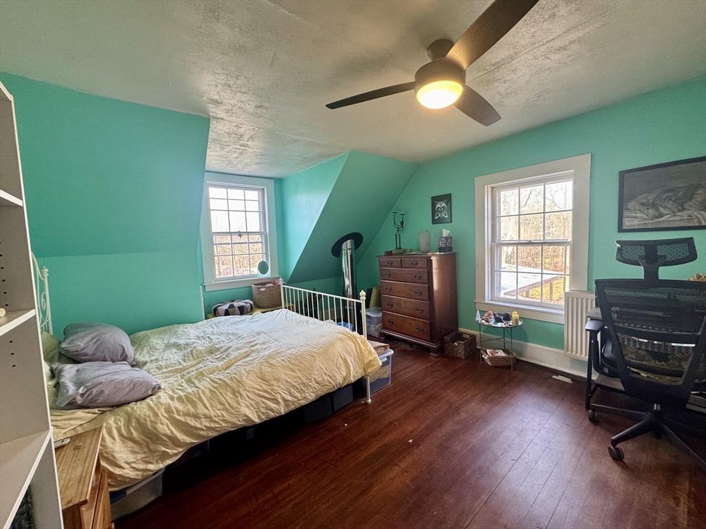 8 Ring Road Worthington, MA 01098 - Photo 10 of 14 a bedroom with a bed and a chandelier