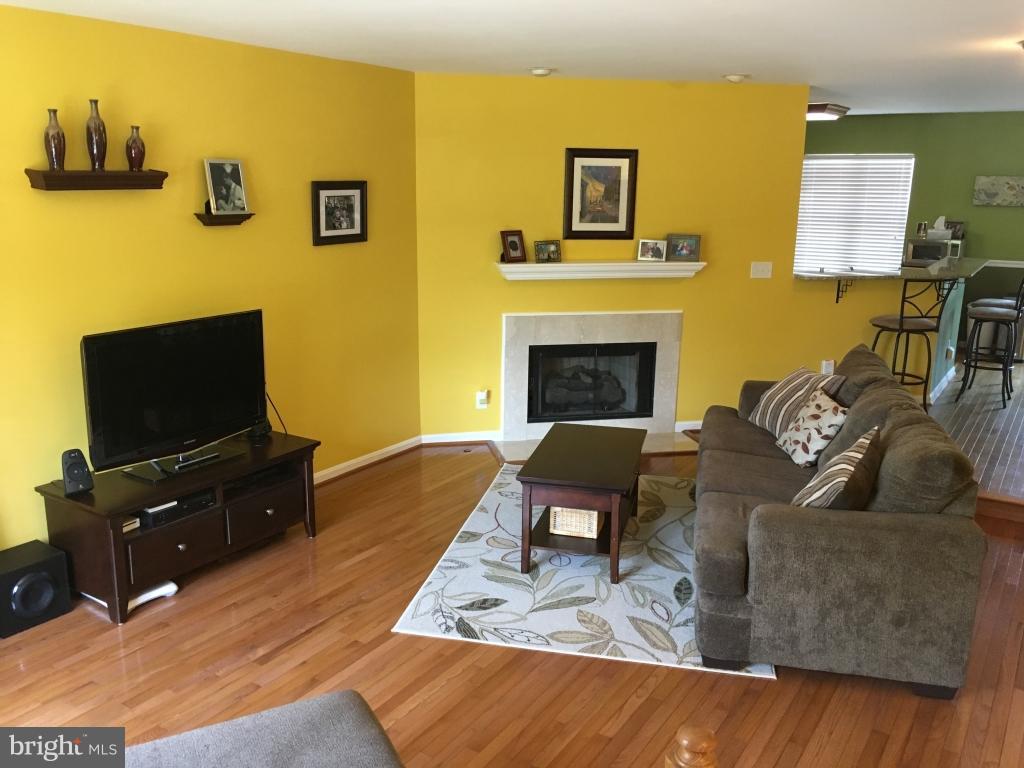 202 Rugby Road Fredericksburg, VA 22406 - Photo 2 of 29 a living room with furniture and a flat screen tv