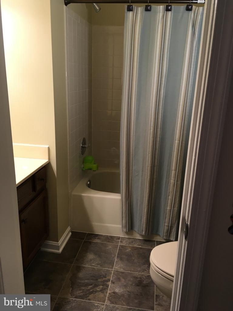 202 Rugby Road Fredericksburg, VA 22406 - Photo 18 of 29 a bathroom with a sink a toilet a bathtub and a shower